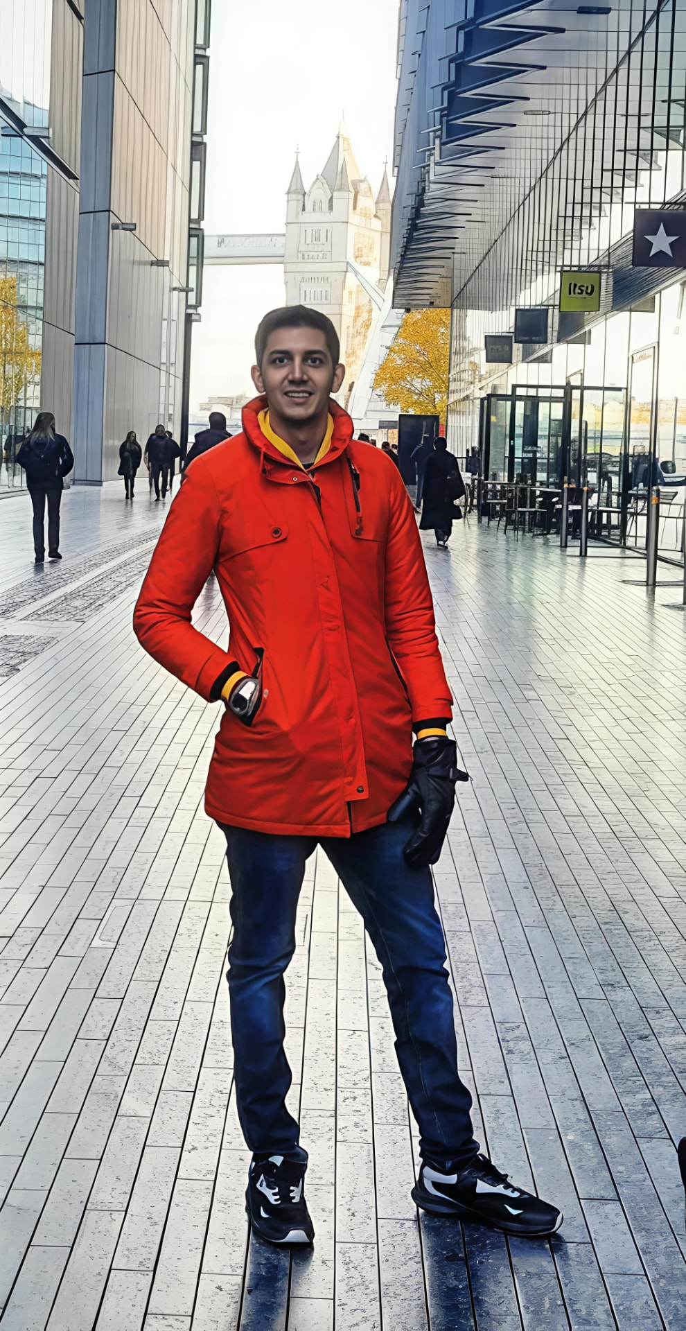 Vinay Dambani standing on a London riverside walkway near Tower Bridge